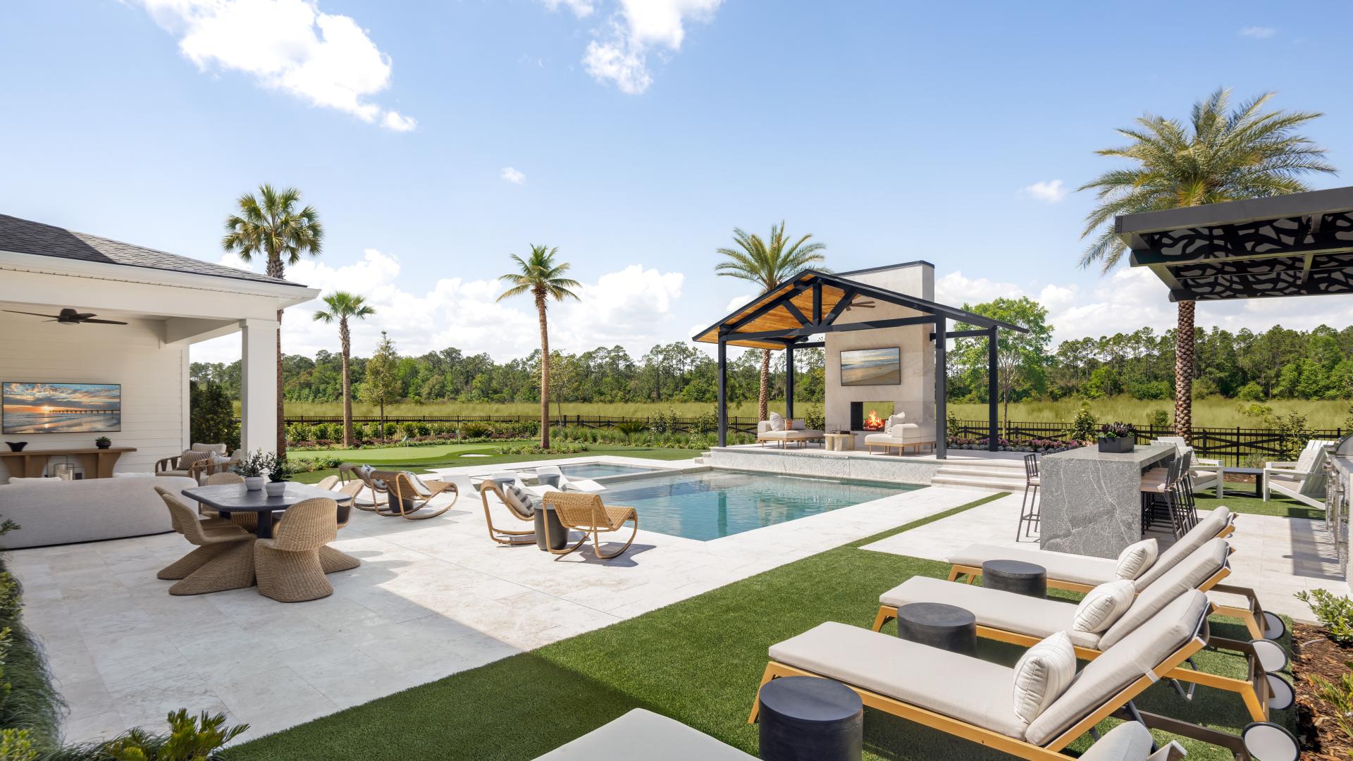 Resort-style pool and covered pavilion at an Iron Branch home