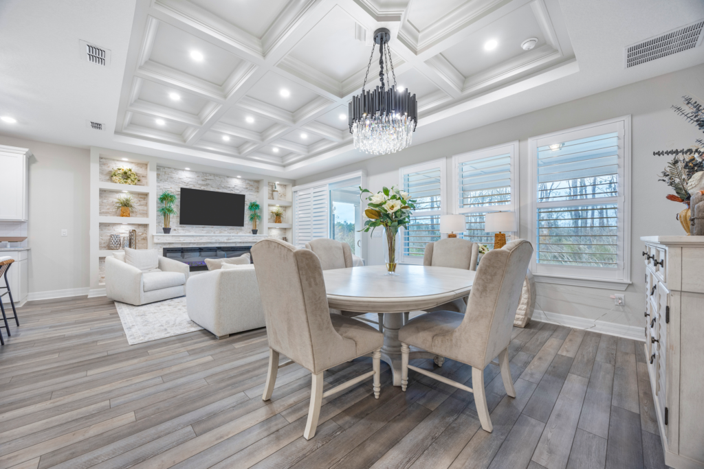 Dining area with chandelier, plantation shutters and coffered ceiling at 94 Hickory Pine Drive St. Augustine