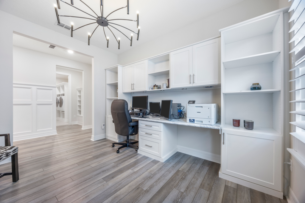 Built-in home office with cabinetry and desk in the flex room at 94 Hickory Pine Drive St. Augustine